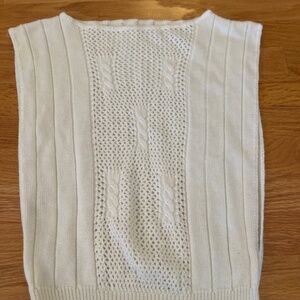 Vintage women’s small cream knit vest with long slits on the sides